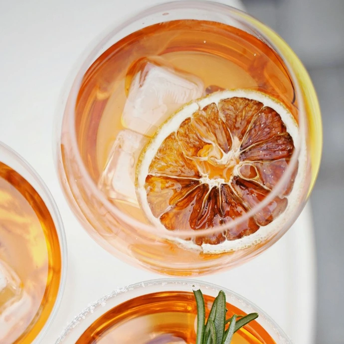 four glass cups on white surface