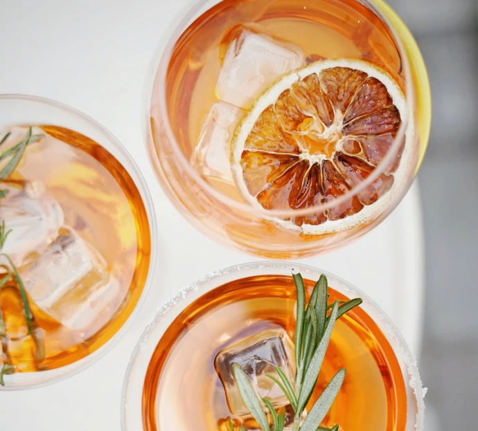 four glass cups on white surface